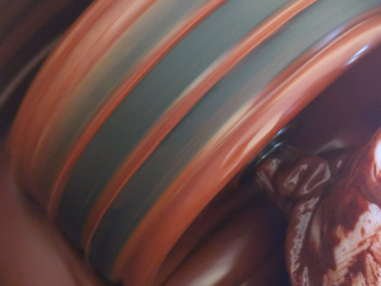 Cocoa beans being ground
