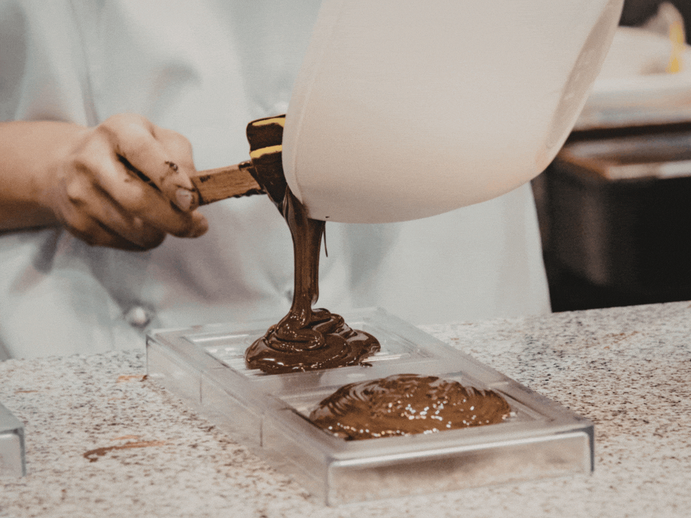 Hand-sorting cocoa beans before roasting